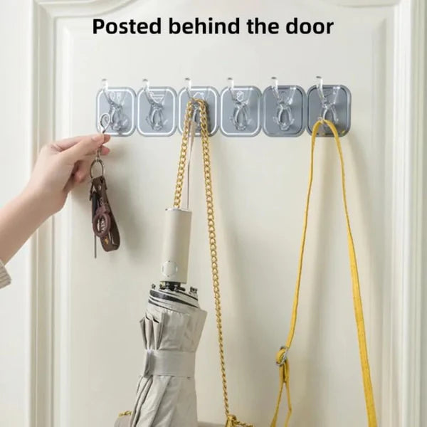 Tarjah Mart AM5095 Six Hook Sticky Wall Hanger, 6-piece multipurpose wall hooks with adhesive backing for versatile home organization.