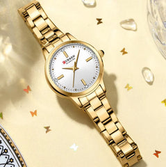 Curren 9094 women's luxury stainless steel watch with green and gold accents, featuring a sleek design and gold-tone dial.