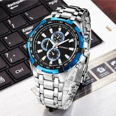 Silver and blue Curren 8023 men's watch with a round dial and metal band, showcasing a stylish and modern design.