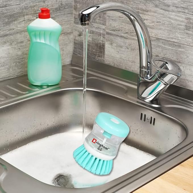 Dish wash brush by Tarjah Mart, a dishwasher cleaning palm brush with a handle, ideal for scrubbing dishes and kitchenware.