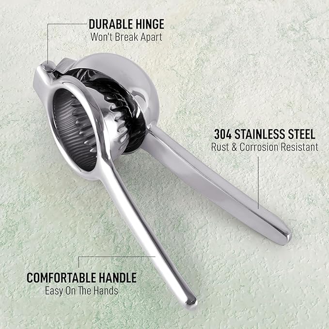 Stainless steel lemon squeezer manual hand press juicer on kitchen counter, durable and easy to use for fresh citrus juice.
