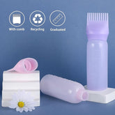 Heir oil bottle by Tarjah Mart, clear glass container with a black cap, designed for storing cooking or medicinal oils.