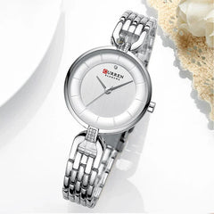 Close-up of a Curren 9052 Ladies luxury women's watch with a sleek silver dial and elegant design.