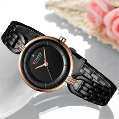 Elegant Curren 9052 ladies' luxury watch with a sleek design, featuring a round dial and stylish band, perfect for women.