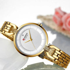 Elegant Curren 9052 ladies' luxury watch with a sleek design, stainless steel band, and stylish watch face for women.