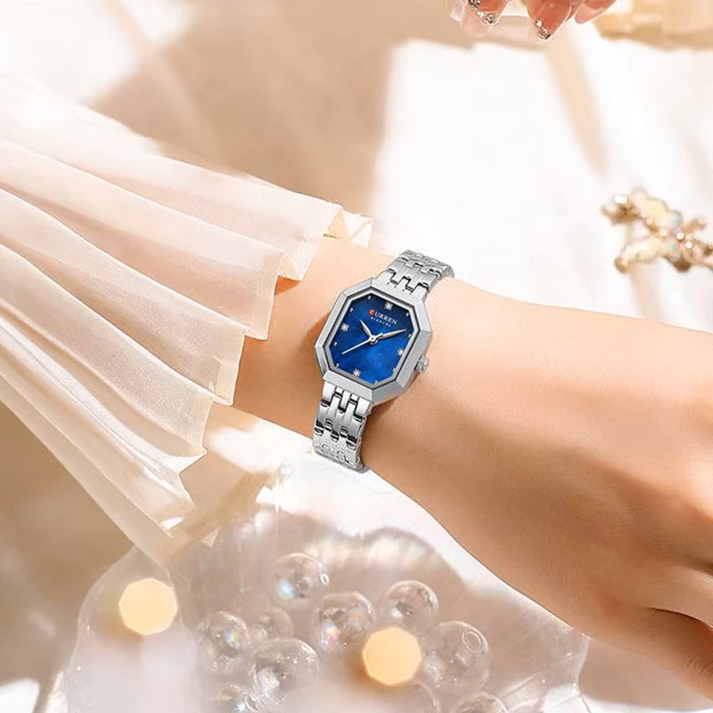 Silver and blue Curren 9108 women's fashion square stainless steel band watch, showing the stylish rectangular dial.