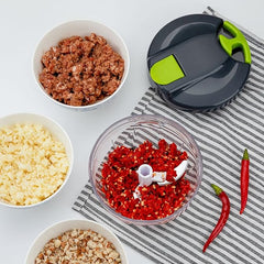 Hand chopper blinder from Tarjah Mart, kitchen vegetable chopper with sharp blades for easy chopping and food preparation.