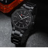 CURREN 8477 men's quartz watch with a gold and silver stainless steel band, white dial, and auto-date display.