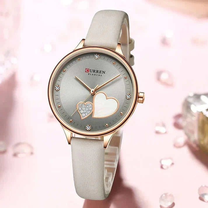 Women's leather strap watch by Curren featuring a sleek round dial and elegant design, perfect for stylish everyday wear.