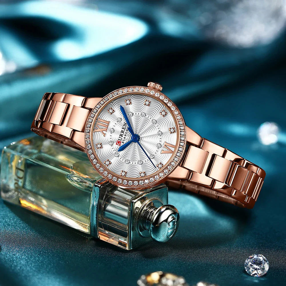 Women's stainless steel watch by Curren, model 9085, featuring a sleek round dial and elegant design.
