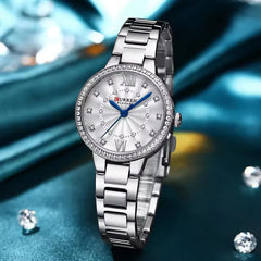 Women’s stainless steel watch by Curren, model 9085, featuring a sleek round dial and elegant bracelet design.