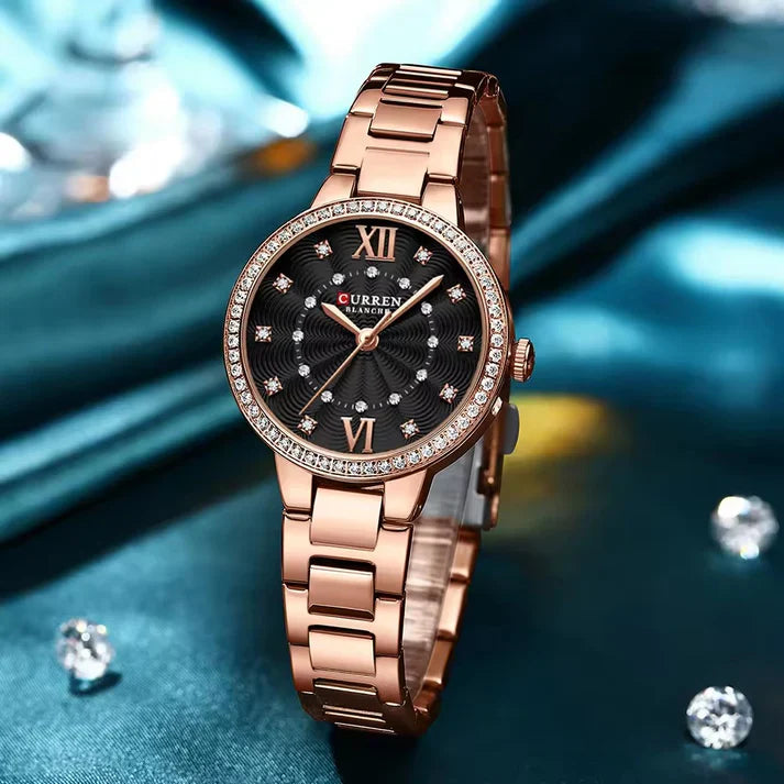 Women’s stainless steel watch from Curren 9085 model with a sleek silver band and round dial.