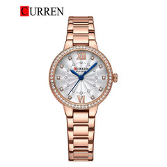 Women's Curren 9085 stainless steel watch with a sleek round dial and silver strap, stylishly displayed on a white background.