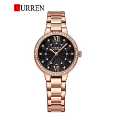 Women's stainless steel watch from Curren 9085 model with a sleek design and round dial, displayed on a white background.