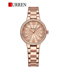 Women's stainless steel watch from Curren 9085 model with a sleek design and round dial, featuring a silver-tone finish.