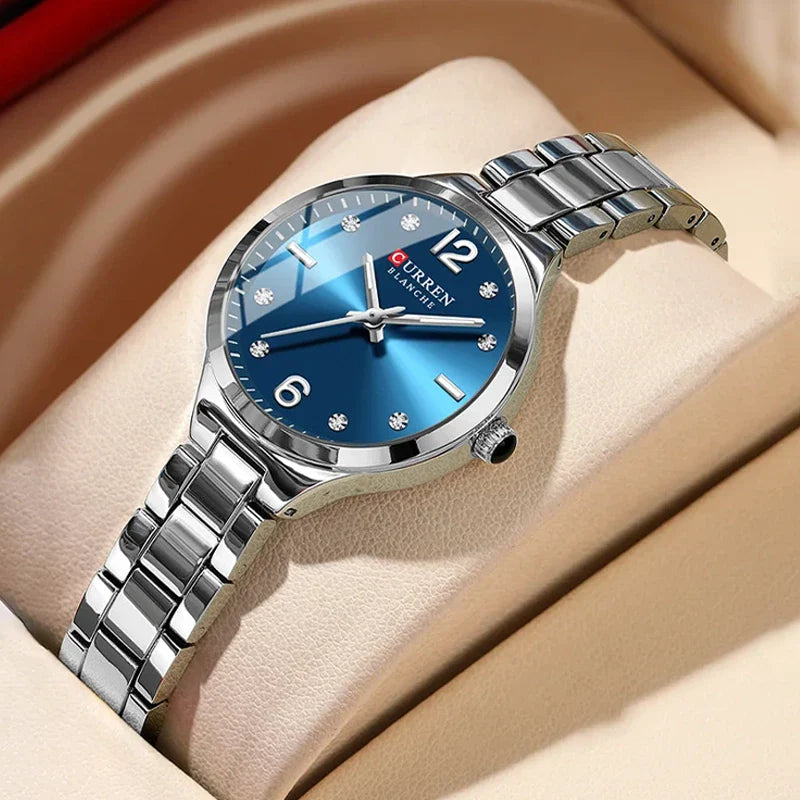 Women's stainless steel watch by Curren, model 9105, with a sleek round face and elegant design.