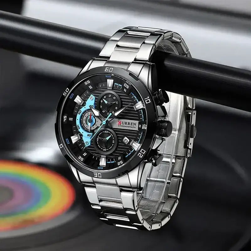 Black stainless steel men's watch by Curren with a sleek round dial and metal bracelet, showcasing a modern and stylish design.