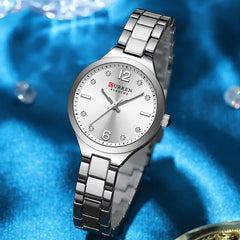 Women's stainless steel watch by Curren, model 9105, with a sleek silver dial and elegant design.