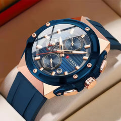 Blue Curren 8462 men's rubber strap watch showing a round dial with silver accents and a modern sporty design.
