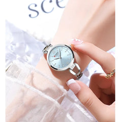 Elegant Curren 9092 ladies watch with light blue dial and silver stainless steel band, showcasing luxury and sophisticated style.