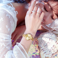Elegant Curren 9092 women's luxury stainless steel watch with a light blue dial and gold-tone finish, showcasing a sophisticated design.