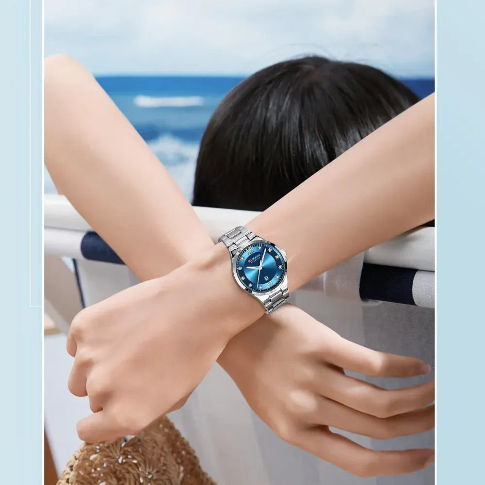 Silver and blue Curren 9107 women's quartz fashion watch with stainless steel band and elegant design