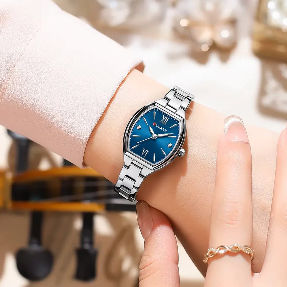 Silver Curren 9112 luxury women's quartz watch with stainless steel band and white dial, stylish and elegant accessory.