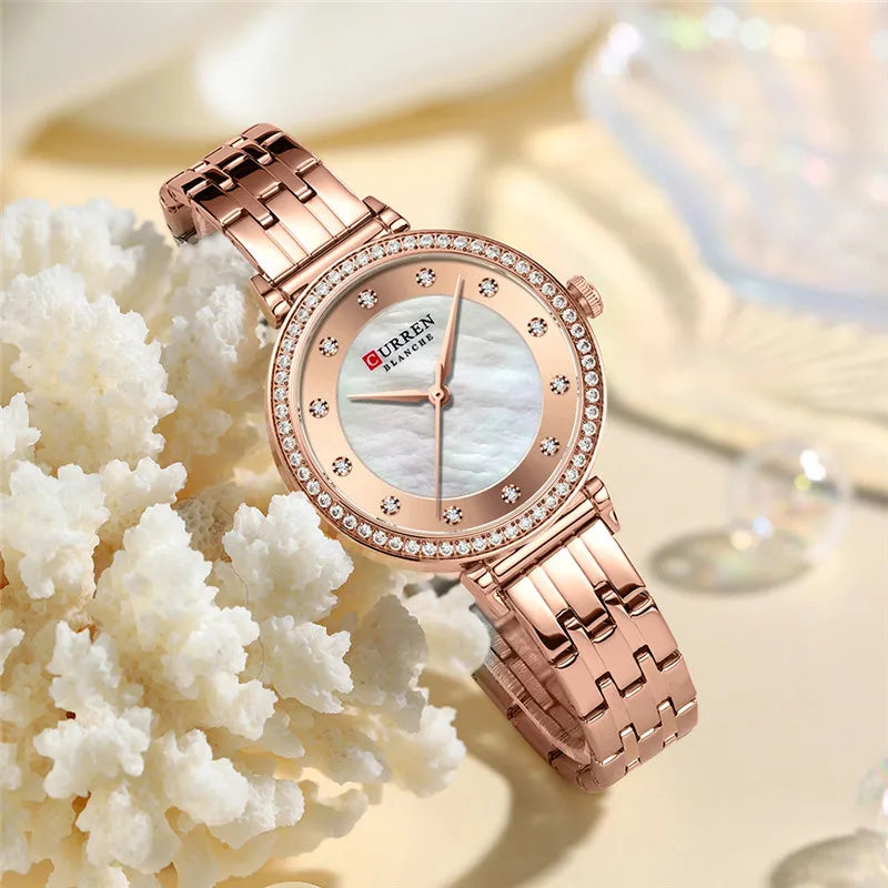 Women's stainless steel watch by Curren, model 9087, with a sleek design and silver-tone finish.