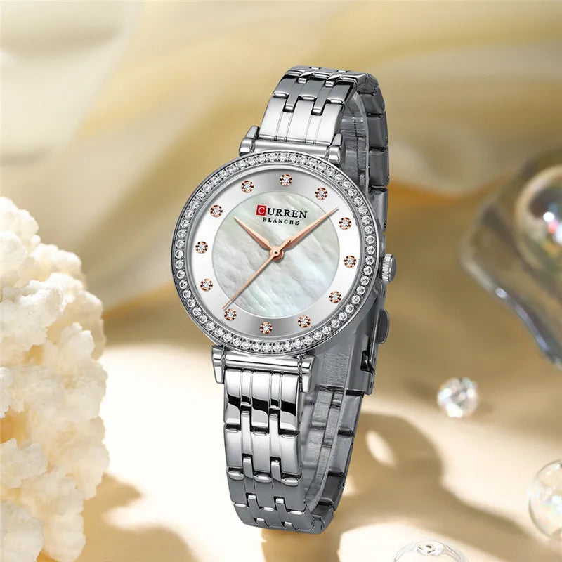 Curren 9087 women's stainless steel watch with a silver dial and metal band, stylish women's wristwatch by Curren.