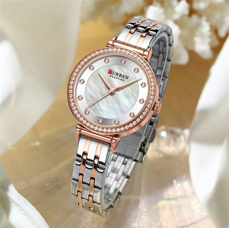 Curren 9087 women's stainless steel watch with a sleek design, featuring a round dial and silver-tone band.