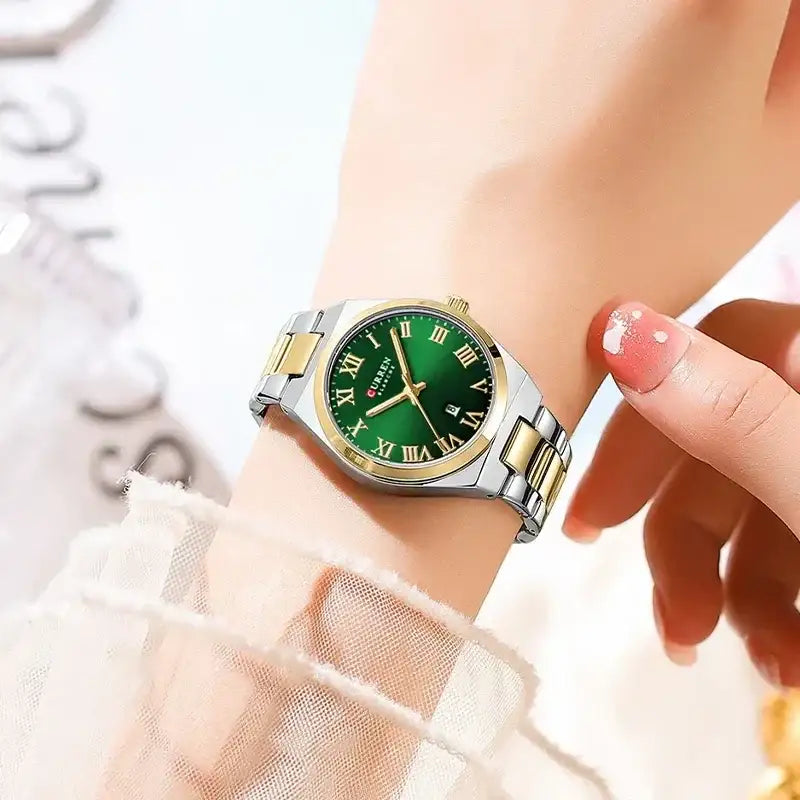 Women’s stainless steel watch by Curren with a green dial and sleek design, perfect for stylish everyday wear.
