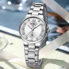 Silver and blue Curren 9107 women's quartz fashion watch with stainless steel strap and elegant design.