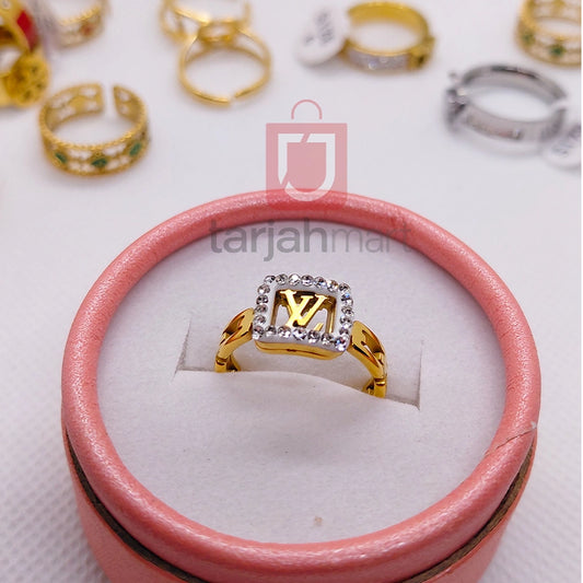 Elegant LV women's finger ring by Tarjah Mart featuring stylish design and intricate details on a sleek metal band.