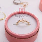 Women's trendy finger ring with stone from Tarjah Mart, showcasing a stylish design with a sparkling central gemstone.