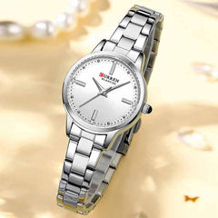 Curren 9094 women's luxury stainless steel watch with a green and gold dial, elegant design and gold-tone accents.