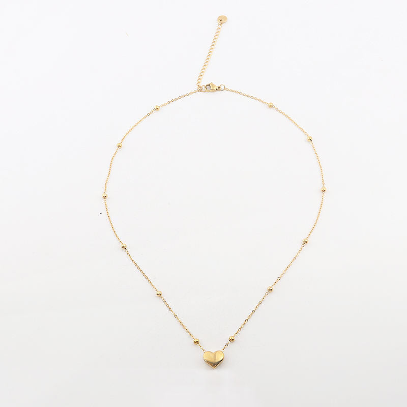 Stainless steel heart necklace featuring a sleek, polished pendant on a delicate chain, designed by Tarjah Mart.