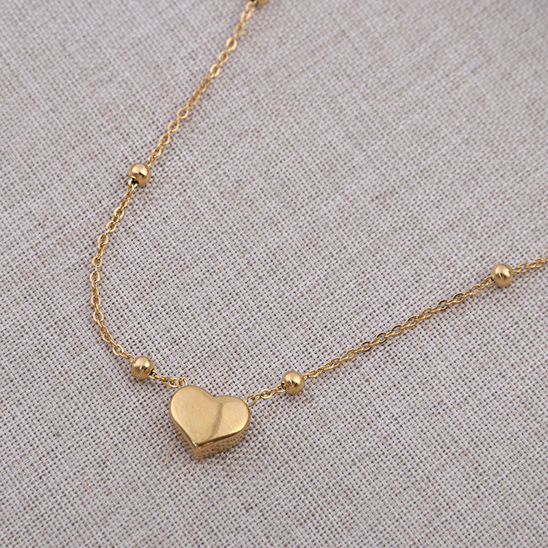 Stainless steel heart necklace from Tarjah Mart featuring a polished, elegant pendant on a delicate chain.