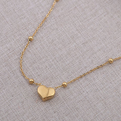 Stainless steel heart necklace from Tarjah Mart featuring a polished, elegant pendant on a delicate chain.