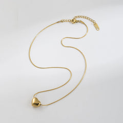 Shiny stainless steel face love necklace from Tarjah Mart with a sleek, polished design and a heart-shaped pendant.