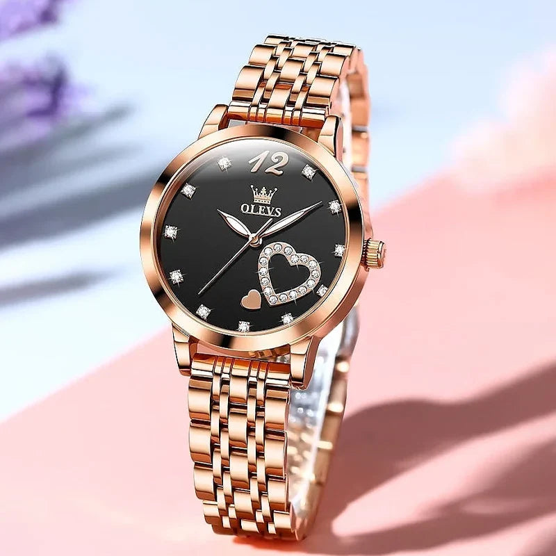 OLEVS 5189 luxury ladies steel band watch showing a sleek silver design with a round dial and elegant detailing.