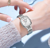 Silver and white Curren 9093 women’s fashion quartz watch with a sleek round dial and elegant design.