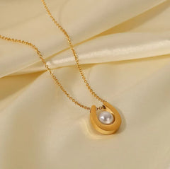 Gold plated stainless steel U-shaped pearl pendant necklace with round pearls, stylish jewelry from Tarjah Mart.