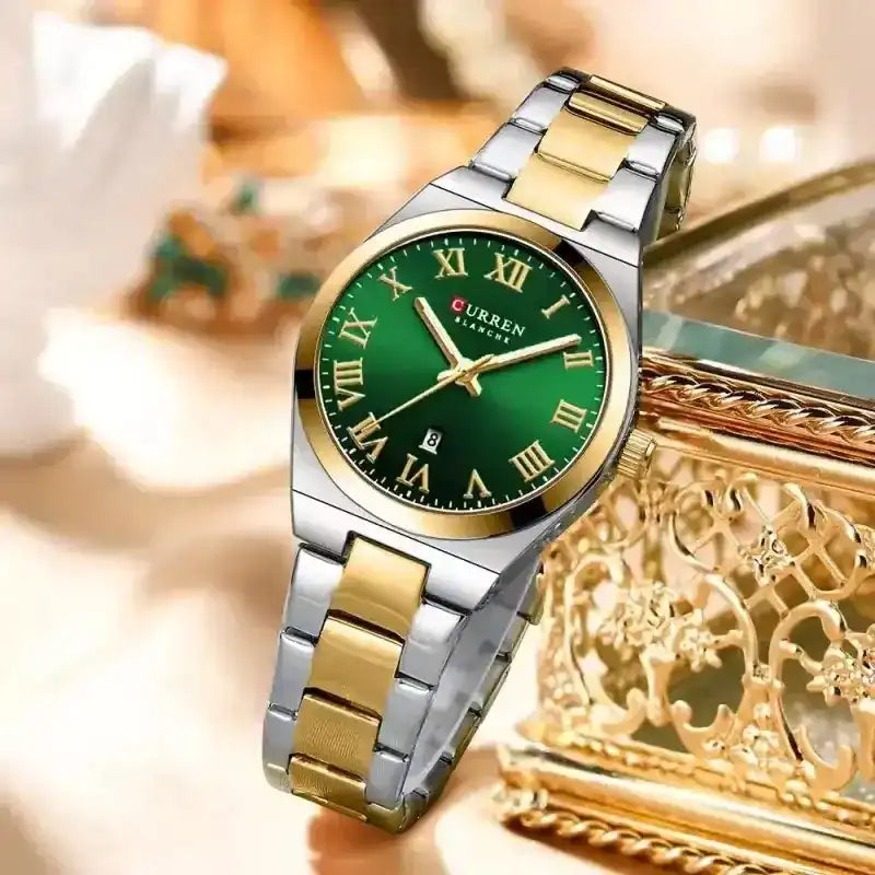 Women's green stainless steel wristwatch by Curren, featuring a stylish round dial and sleek metal strap.
