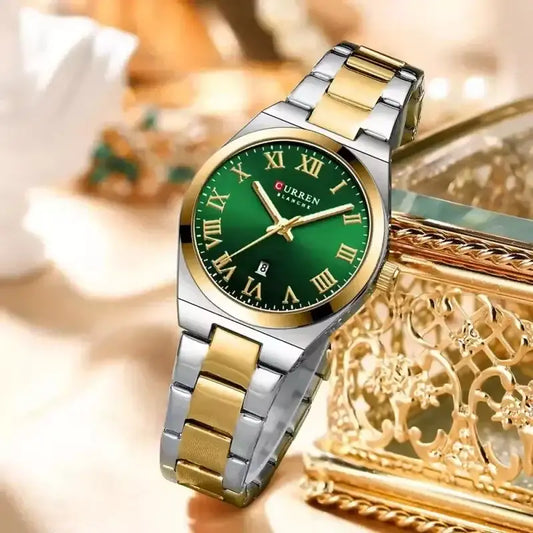 Women's green stainless steel wristwatch by Curren, featuring a stylish round dial and sleek metal strap.