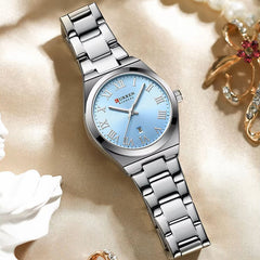 Silver and blue Curren 9095 women's stainless steel watch with a round dial and sleek bracelet design.