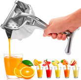 Manual fruit press juicer extractor from Tarjah Mart, showing a sturdy kitchen squeezing tool for fresh juice extraction.
