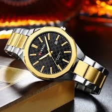 Curren 8477 men's quartz watch with a gold and silver finish, featuring a stylish design and analog display.