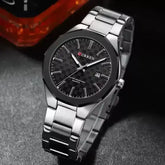 Silver and black Curren 8477 men's quartz watch with a sleek design and round dial, showcasing a stylish men's wristwatch.