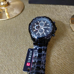 Close-up of Curren 8023 men's quartz waterproof classic watch showing a sleek round dial and stainless steel band.