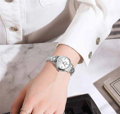Curren 9094 women's luxury stainless steel watch with green and gold accents, featuring a stylish and elegant design.